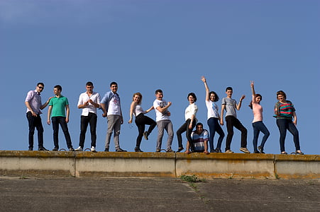 group of people taking photo under clear blue sky thumbnail
