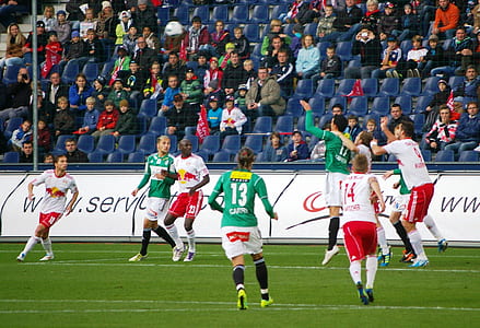 group of men playing soccer thumbnail