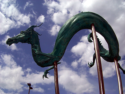 green dragon statue under cloudy sky at daytime thumbnail