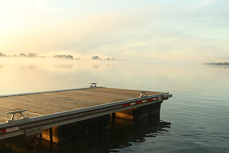 brown boardwalk over ocean thumbnail