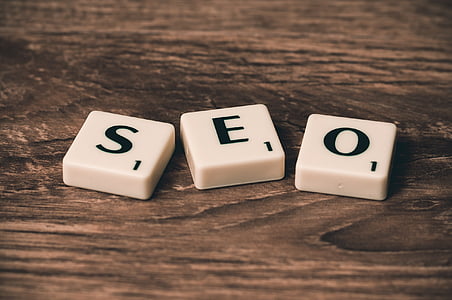 three SEO scrabble pieces on brown wooden surface thumbnail