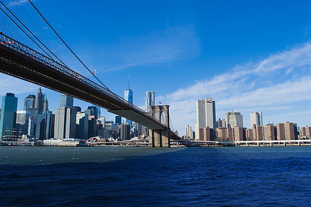 Freedom tower through Brooklyn bridge photo thumbnail