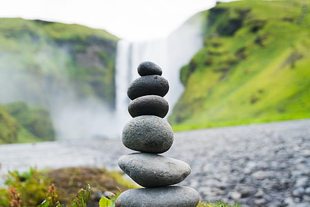 gray stone near waterfall at daytime thumbnail