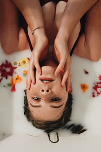 woman in black top laying down on mat liquid thumbnail