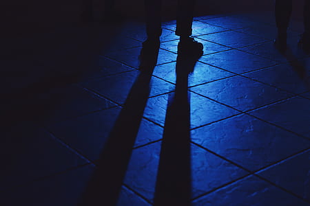 shadow of person standing on white room thumbnail