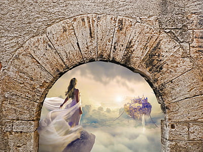 woman in white standing on stone edge thumbnail