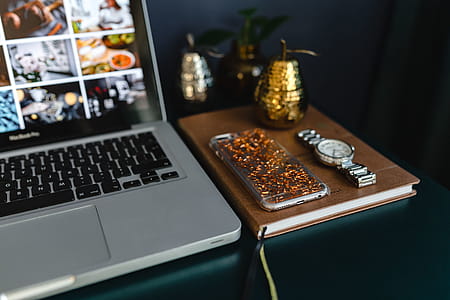 Home office desk with Macbook, iPhone, calendar, watch & organizer thumbnail