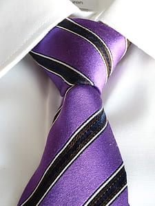 closeup photo of white collared shirt with purple, white, and black striped necktie thumbnail