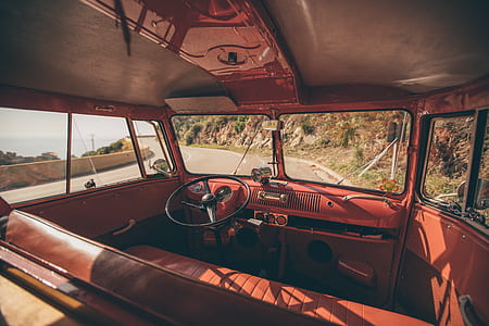 brown vehicle interior daytime on road at daytime thumbnail