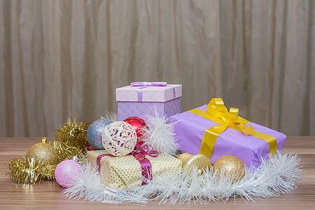 Christmas baubles and gift boxes on table thumbnail