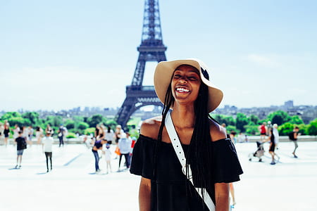 woman standing in front of Eiffel Tower thumbnail