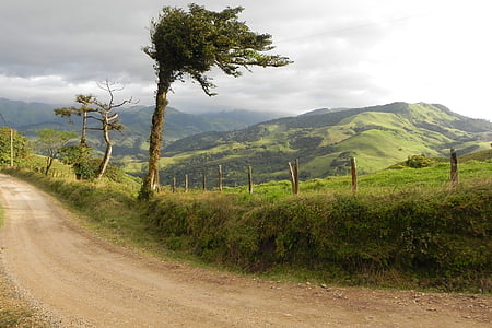 brown road beside mountain thumbnail