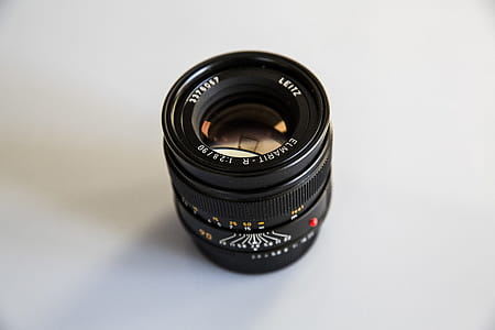 Photo of Black Zoom Lens on White Surface thumbnail