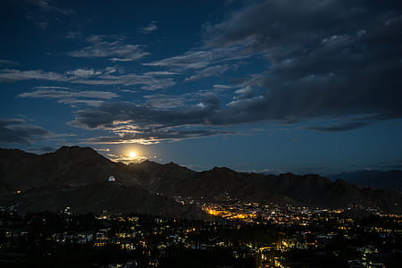 aerial shot of city near mountain thumbnail