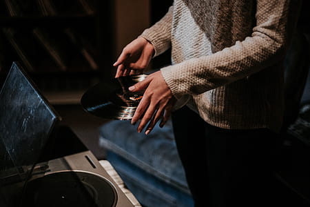 person holding vinyl record thumbnail