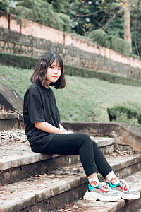 Selective Focus Photography of Woman Sitting on Stairs thumbnail