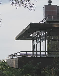 photo of terrace of house near green trees thumbnail