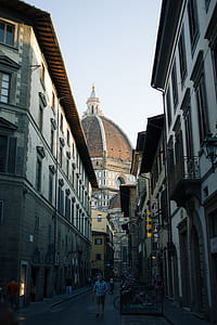 people standing on alley near cathedral thumbnail