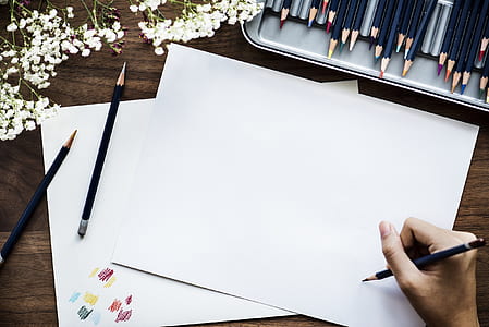 person about to write on printing paper thumbnail