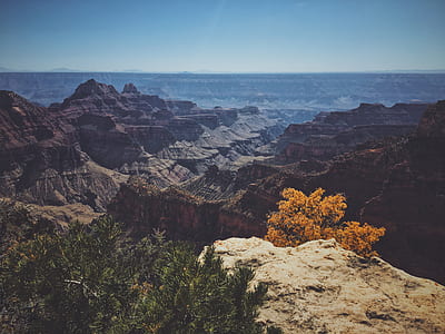 aerial view of mountain ranges under blue sky thumbnail