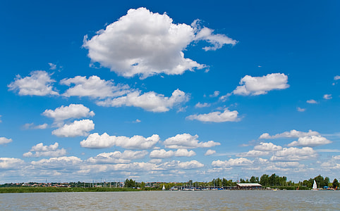 body of water under blue sky at daytime thumbnail