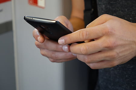 person using black smartphone thumbnail