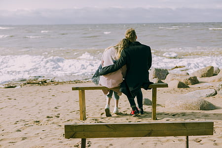 Man and Woman Hugging and Sitting on a Bench thumbnail