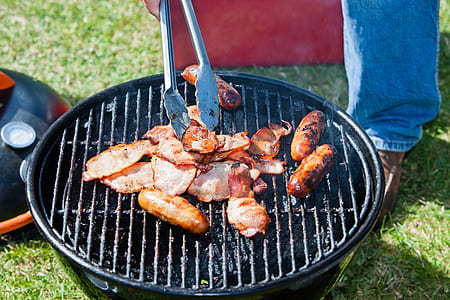 person grilling sausage thumbnail