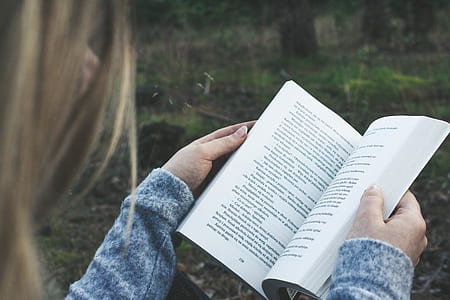 woman holding book thumbnail