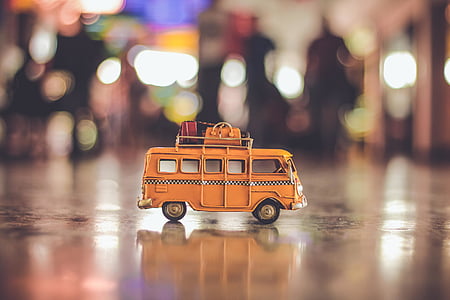bokeh photo of yellow bus toy thumbnail