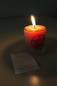 lighted candle with star design thumbnail