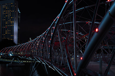 gray metal bridge at nighttime thumbnail