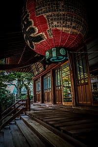 Red Green and Black Floating Lantern With Kanji Text Decoration Above Stairs thumbnail