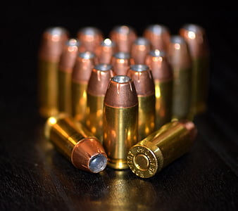 shallow focus photo of gold ammunition thumbnail