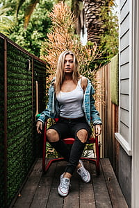 woman sitting on red chair thumbnail