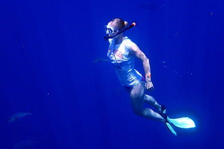 woman snorkeling near turtle thumbnail
