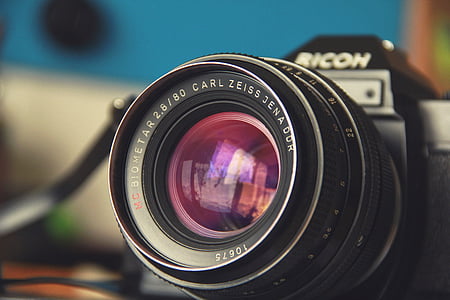 selective focus photography of black Ricoh DSLR camera thumbnail