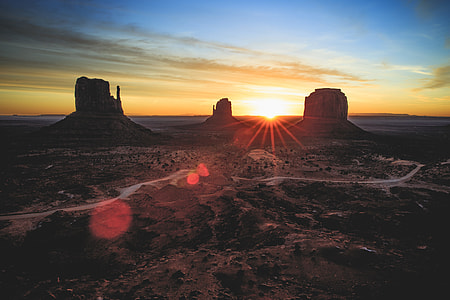 mountains surrounded by dry land during sunset thumbnail