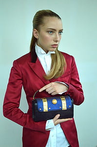 Photography of A Woman Wearing Red Formal Coat thumbnail