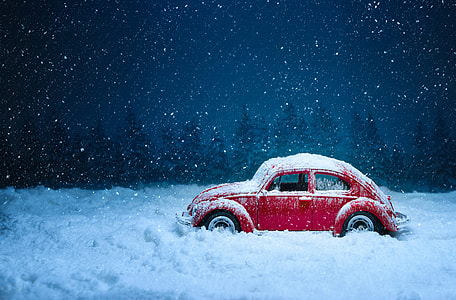 red Volkswagen beetle on ice thumbnail