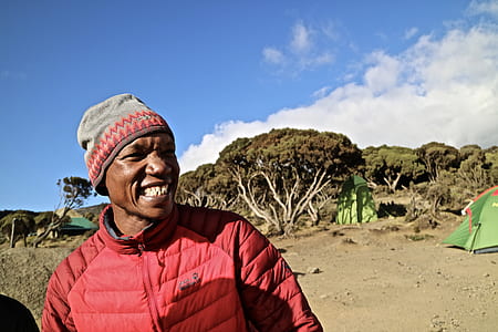 man wearing red zip-up jacket thumbnail