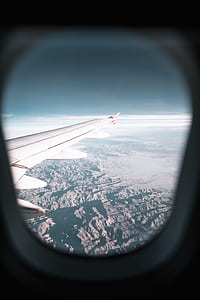 plane-window photography of mountain and cloud thumbnail