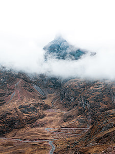 bird's eye view photography of mountain with fogs thumbnail