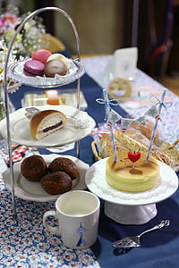 French macaroons and cake on top of plate thumbnail