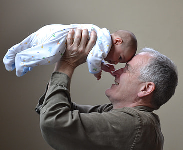 man lifting baby up thumbnail