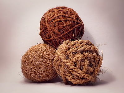 three brown decorative balls on white surface thumbnail