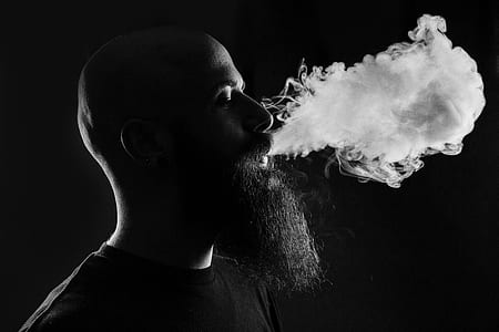 grayscale photography of man smoking thumbnail