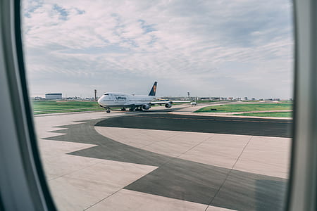 passenger plane under blue sky thumbnail