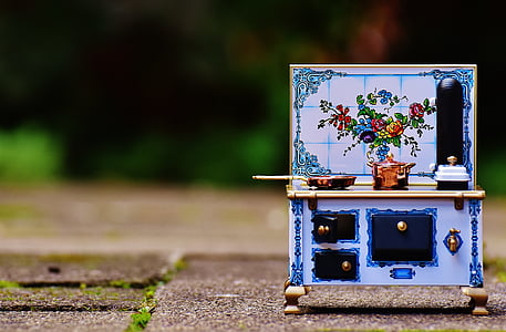 white, blue, and black floral kitchenette on gray concrete surface thumbnail