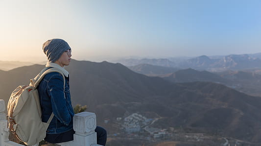 man sitting on railing thumbnail